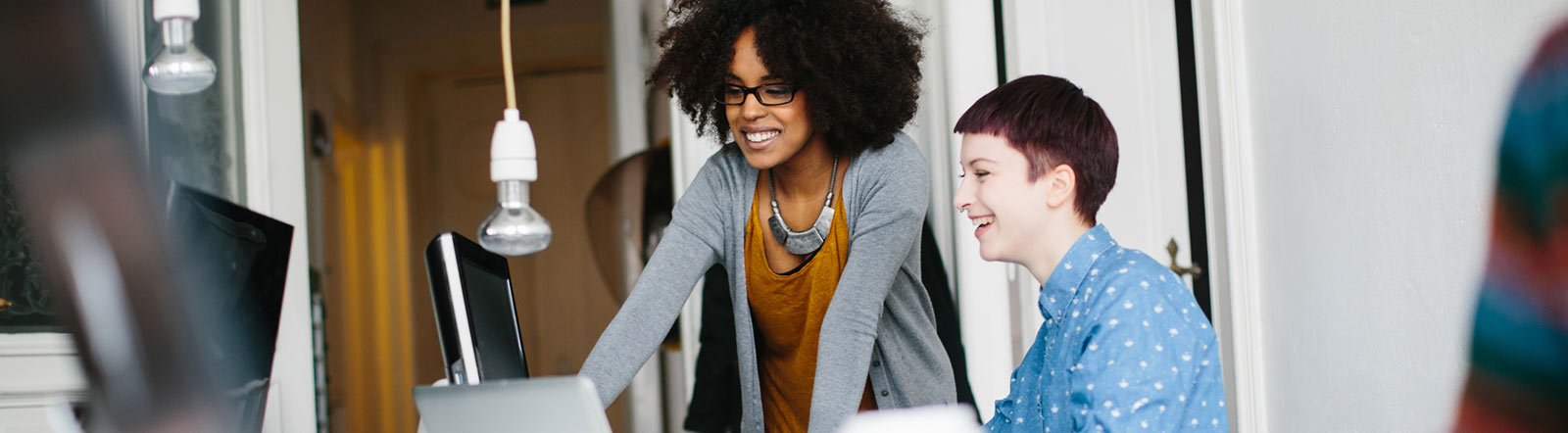 Two woman in the office working.