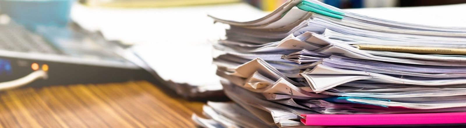stack of papers on desktop