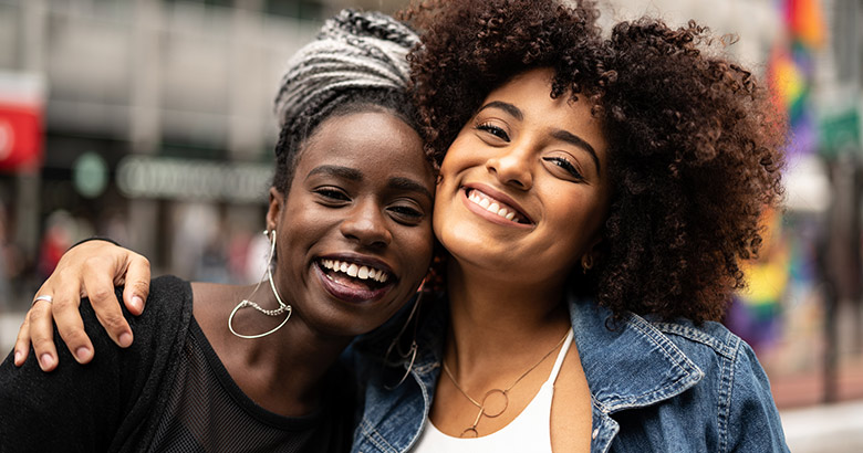 Two friends smiling.