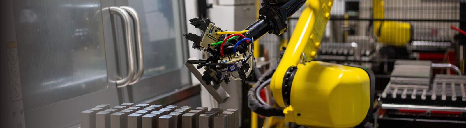 robotic machine processes raw metal material
