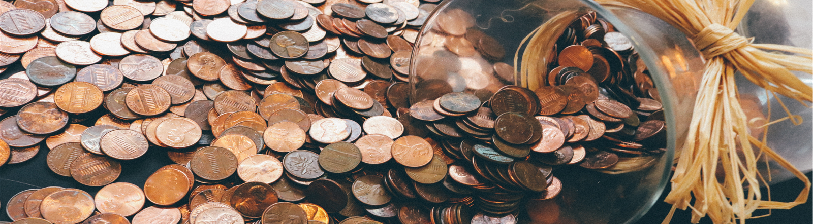 Pennies spilling out of a jar